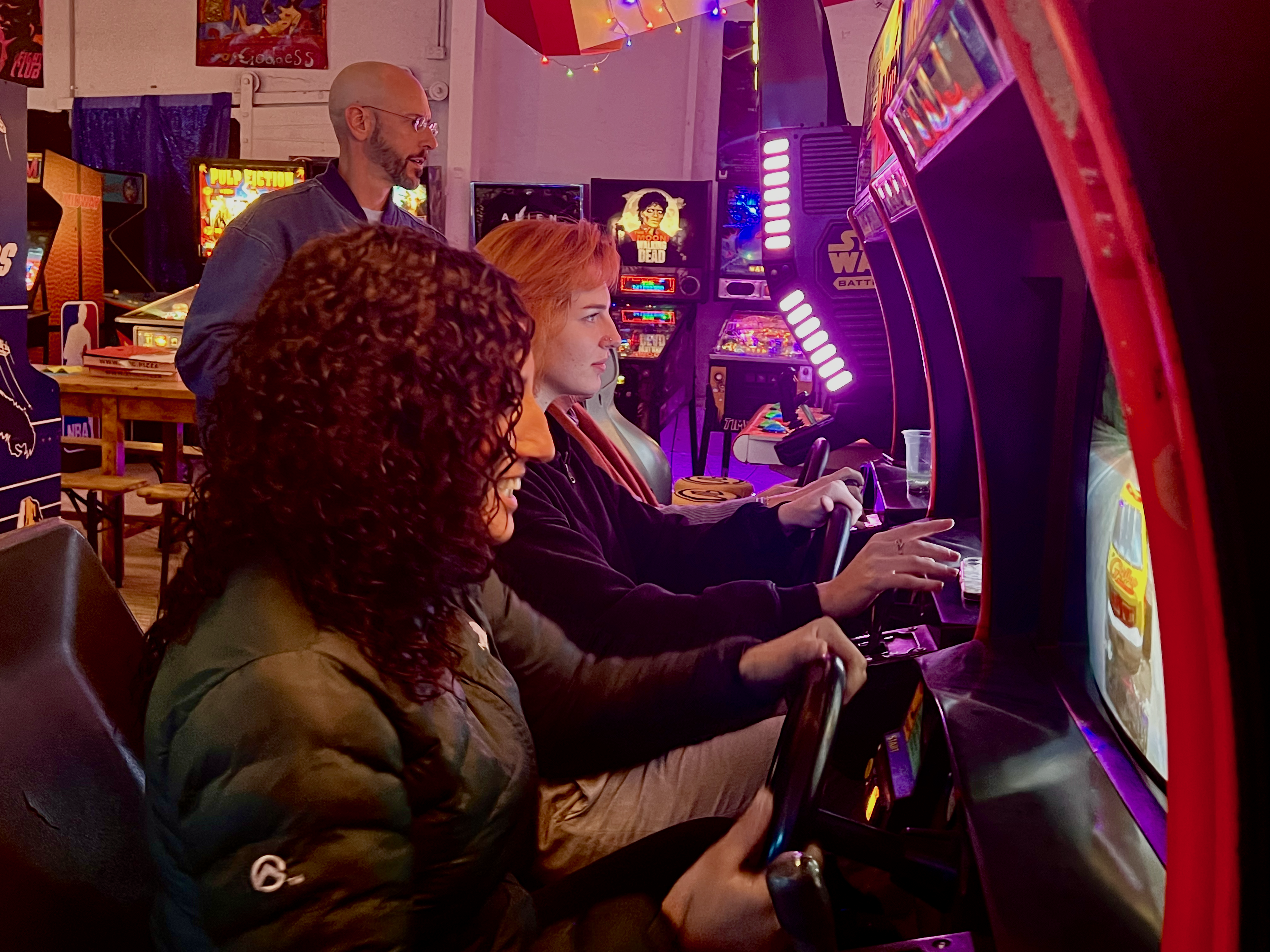 Players battling it out on the arcade challenge cabinet during Retro Trivia